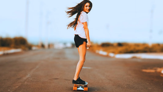woman learning to skateboard
